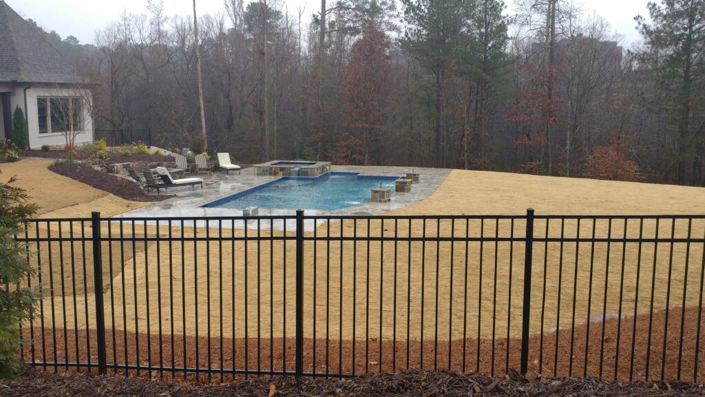 Black flat-top aluminum pool fence