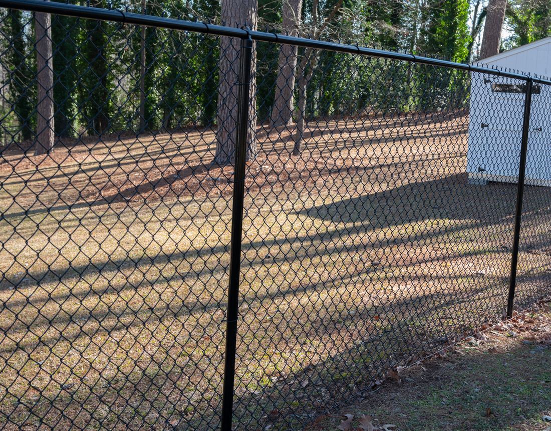 Black vinyl-coated residential chain link fence