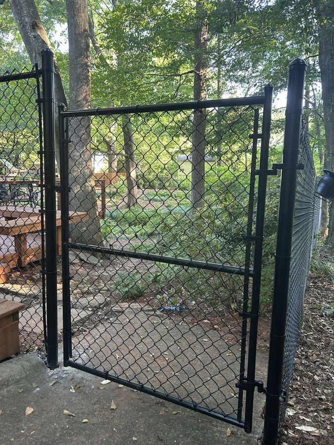 Chain link dog kennel enclosure