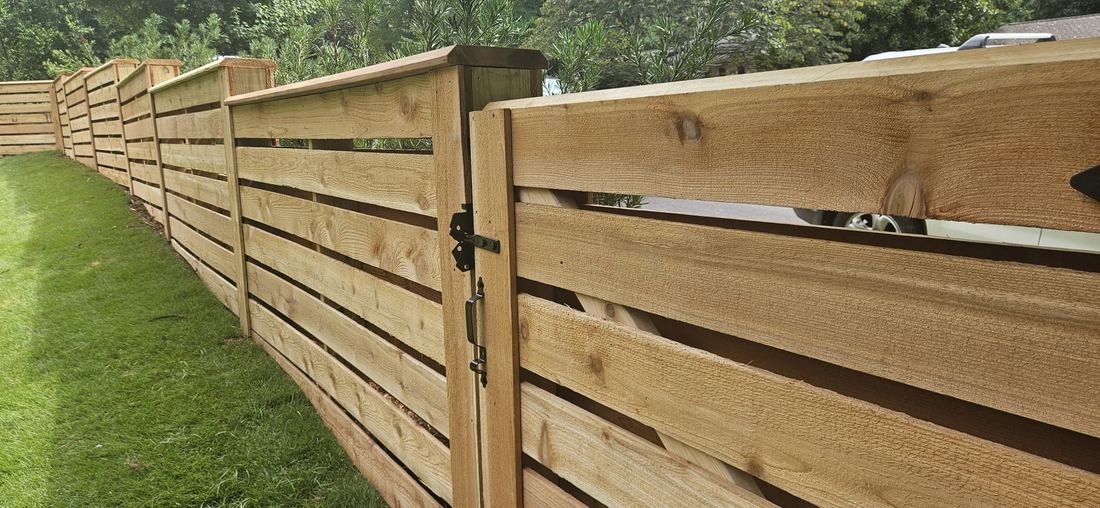 Cedar horizontal wood fence with a beveled cap