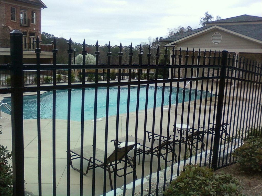 Steel pool fence with decorative spear-top finials