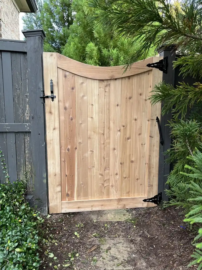 Custom wood drive gate and cedar privacy fence in Chamblee