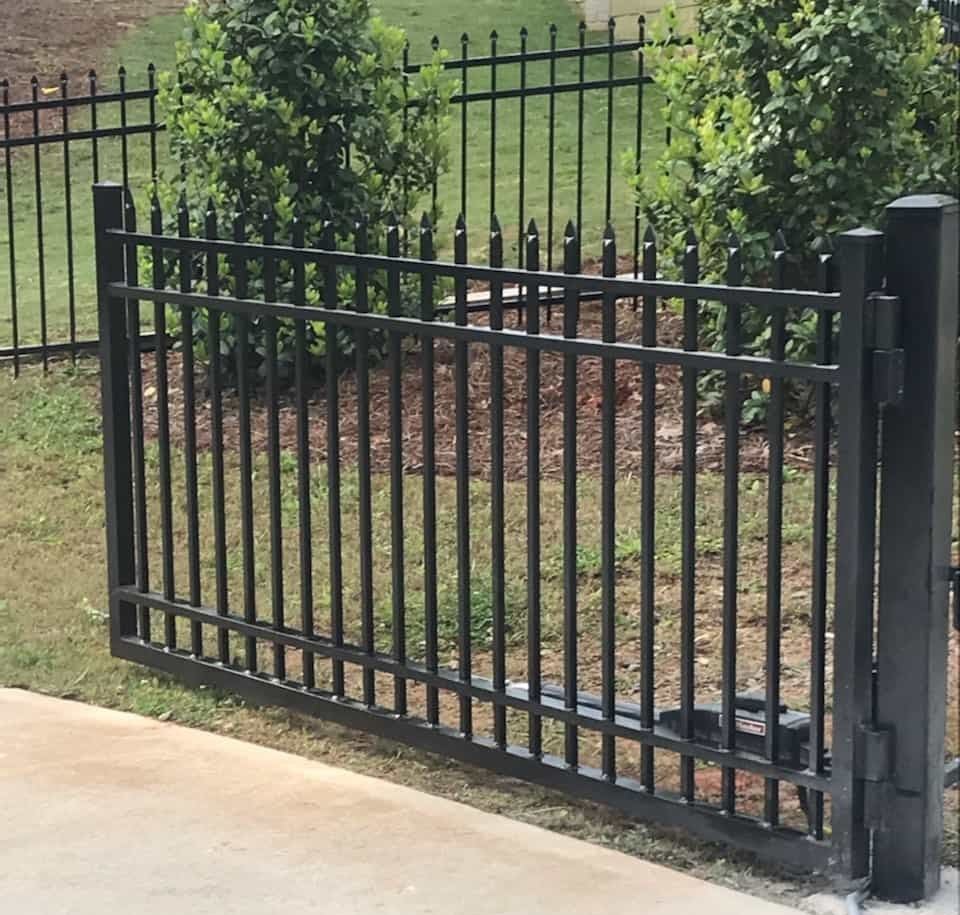 Single aluminum spear-top driveway gate with access controls