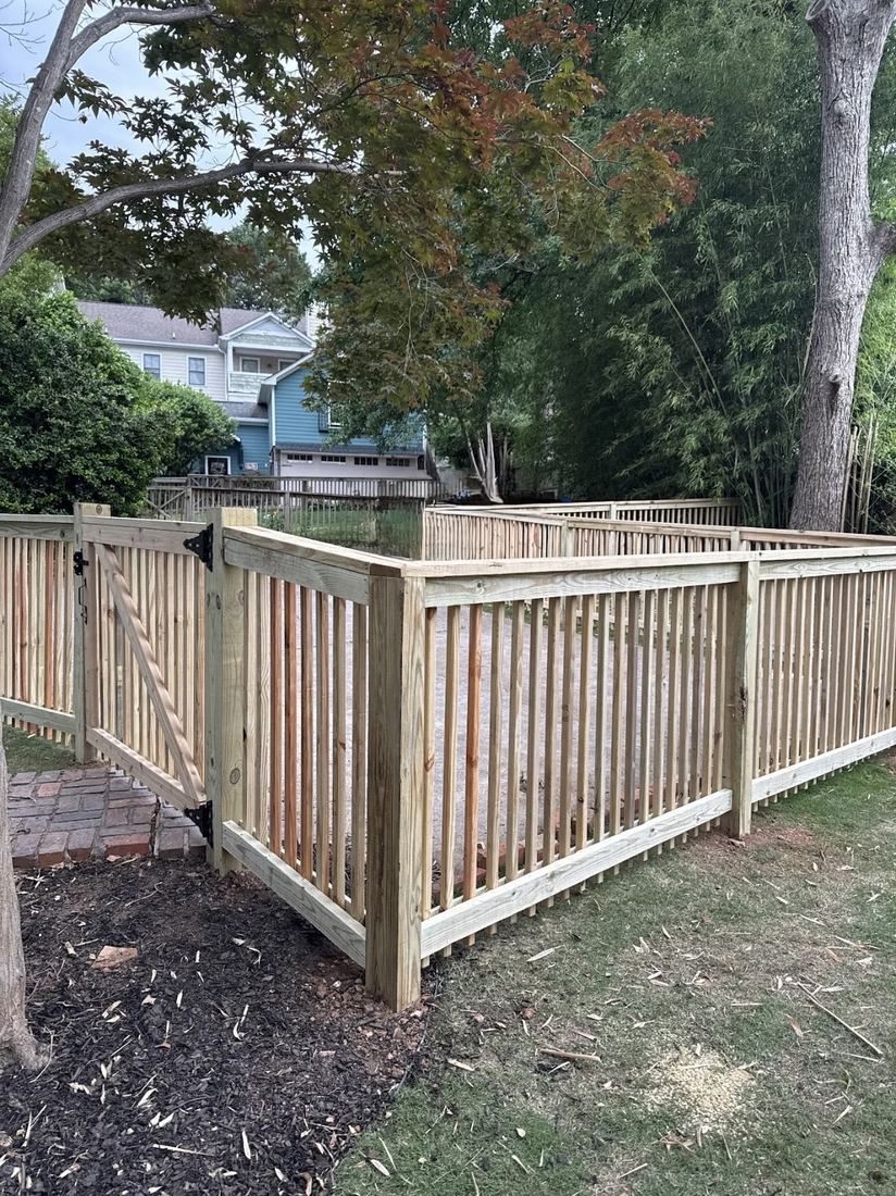 Capped wood 2x2 picket fence with 4x6 posts