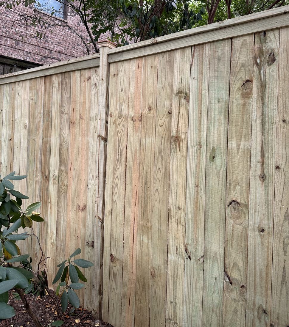 Double-sided capped wood privacy fence with post caps
