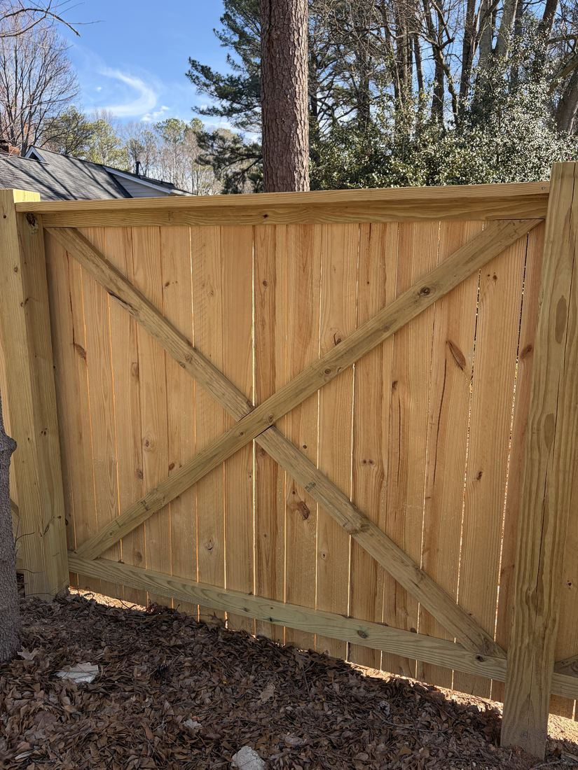 Wood privacy fence with a crossbuck accent and 6x6 posts
