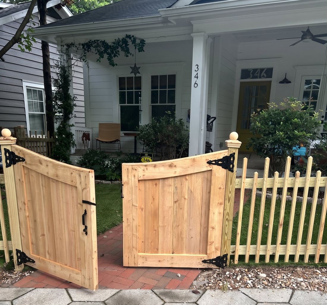 Scalloped cedar double walk gate with a matching 2x2 picket fence