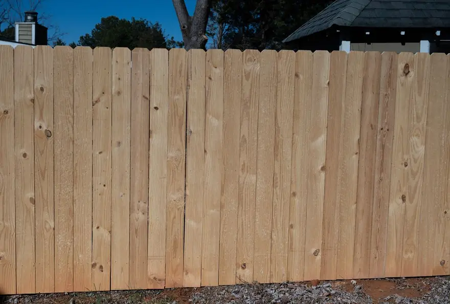 Dog-ear wood privacy fence screening a residential back yard, built by FenceWorks of Georgia