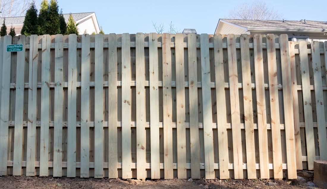 Wood shadowbox privacy fence run