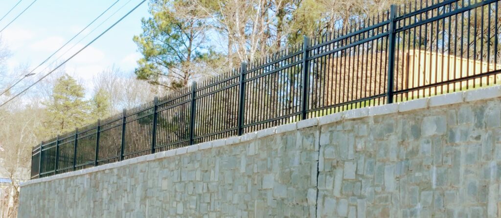 Commercial Metal Fence on Retaining Wall