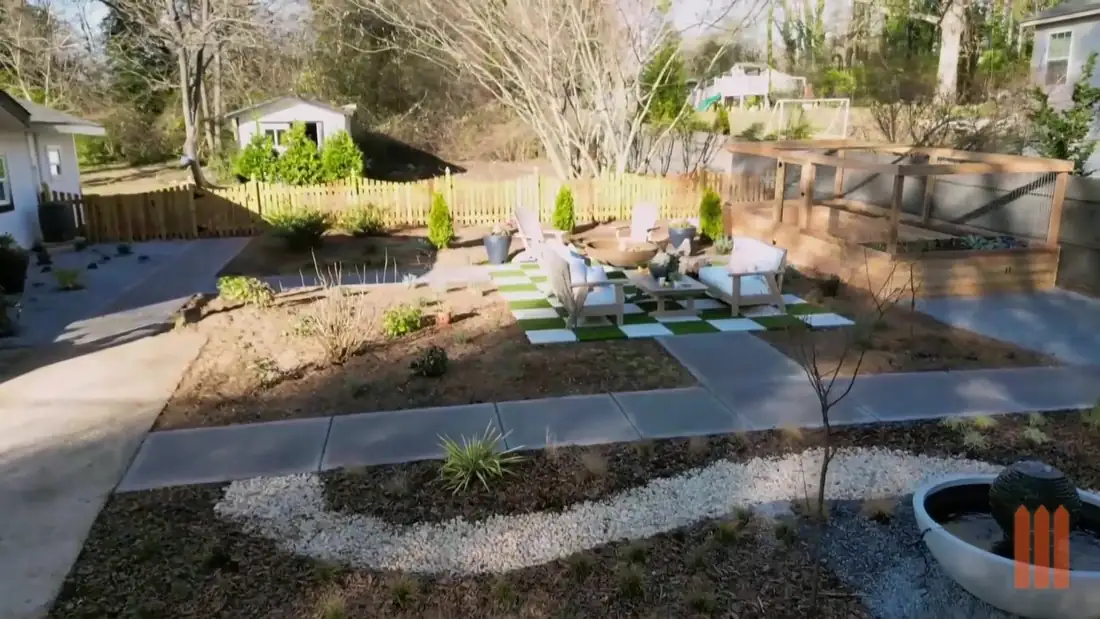 Finished backyard from HGTV's Worst Yard on the Block with the scalloped cedar picket fence FenceWorks of Georgia built in Atlanta